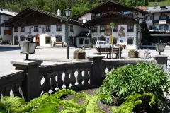 Village square in Wallgau with houses and mountains